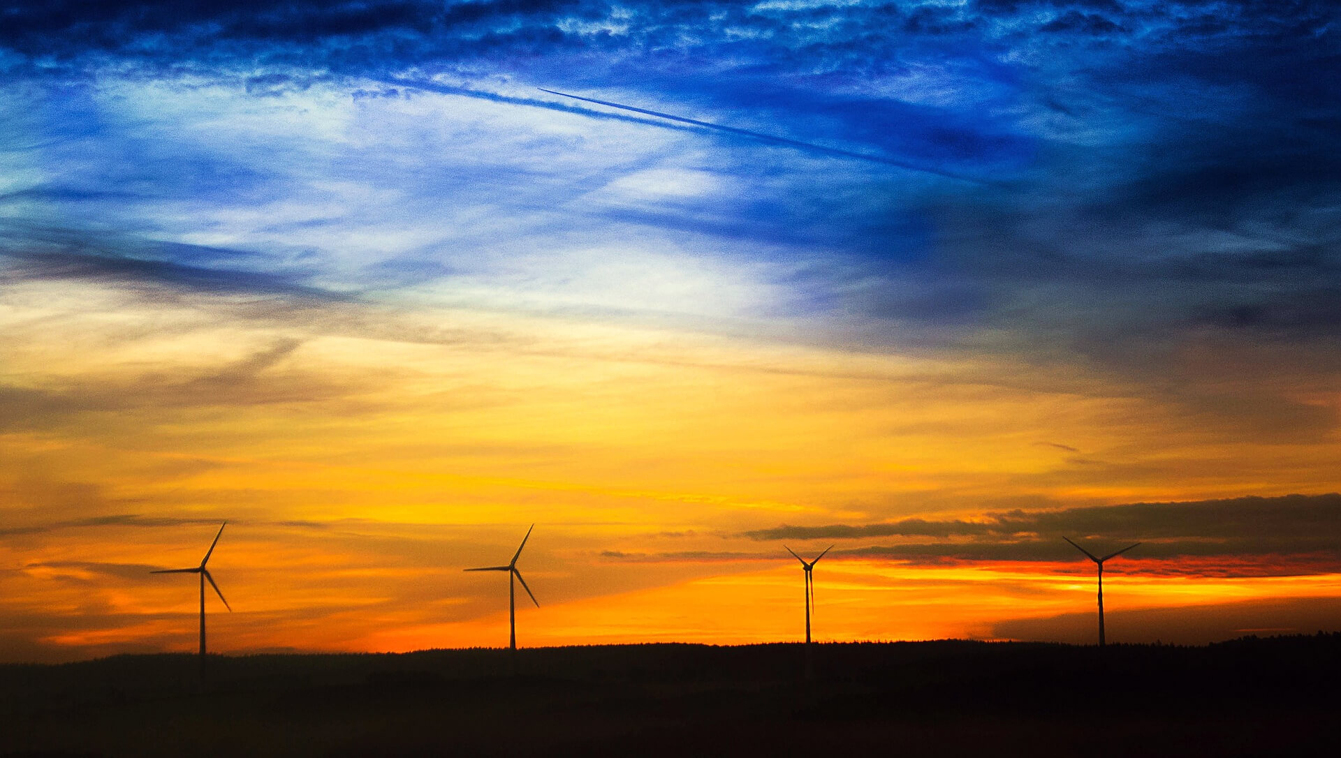 Sunset over the 4 wind turbines